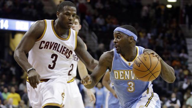 Denver Nuggets' Ty Lawson (3) drives past Cleveland Cavaliers' Dion Waiters (3).