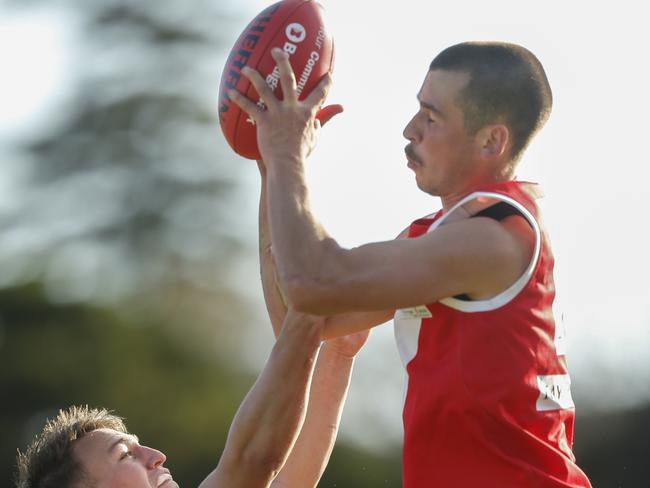 Jonah Siversen marks strongly for Red Hill.