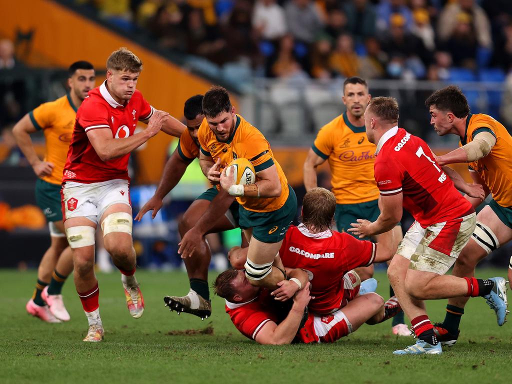 SYDNEY, AUSTRALIA - JULY 06: Liam Wright of the Wallabies is tackled during the men's International Test match between Australia Wallabies and Wales at Allianz Stadium on July 06, 2024 in Sydney, Australia. (Photo by Jason McCawley/Getty Images)