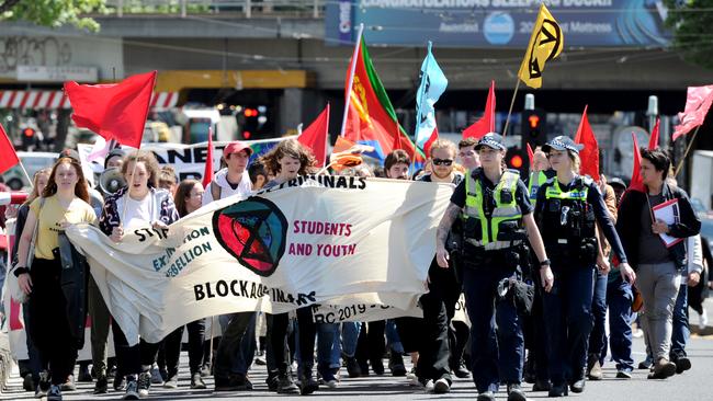 Police monitor protesters against the International Mining &amp; Resources Conference (IMARC) being held at the Melbourne Convention Centre. Picture: Andrew Henshaw