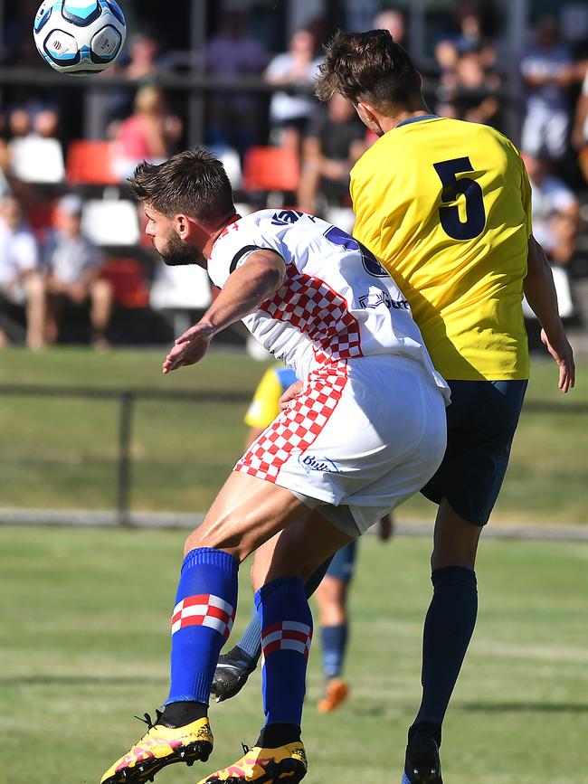 Gold Coast Knights player Sam Smith jumps for the ball in their NPL Queensland clash against South West Queensland Thunder at the Croatian Sports Centre, Carrara. Picture: John Gass