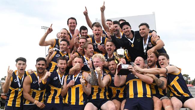 Rupertswood players celebrate the 2019 Riddell District premiership.