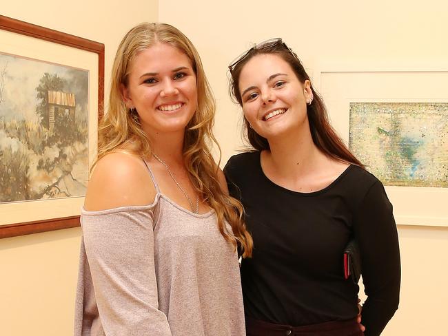 <p>Lucy Downing and Taylor Manning and members of the Cairns Art Society celebrated their 69th Annual Art Exhibition at the official opening of the exhibition at the Cairns Regional Gallery. PICTURE: JUSTIN BRIERTY</p>