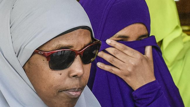 Ms Abdirahman Khalif, right, leaves court following her acquittal. Picture: AAP/Roy Vandervegt.