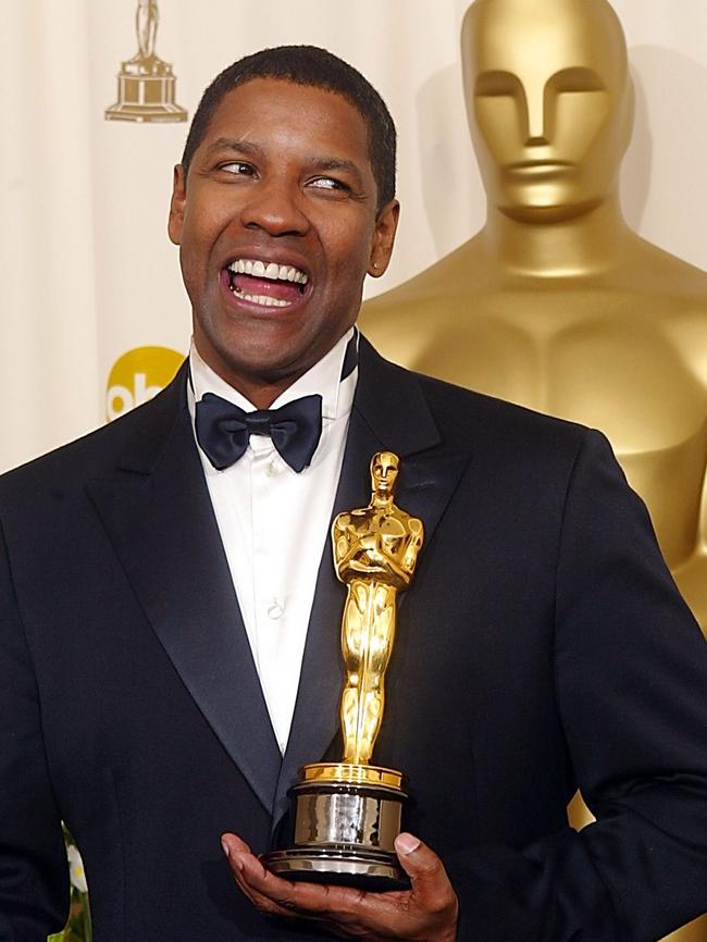 Washington clutches his Oscar after winning Best Actor in 2002 for his role as a detective in ‘Training Day’. Picture: AFP