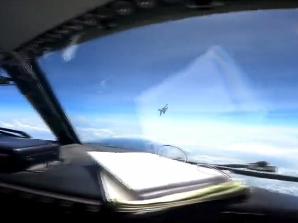 Declassified footage shows the Chinese fighter jet approaching the US surveillance plane. Picture: Supplied