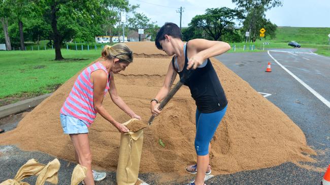 Wet weather in Townsville. Janine and Tameika Day load up with sandbags at Ross River Dam. Picture: Evan Morgan