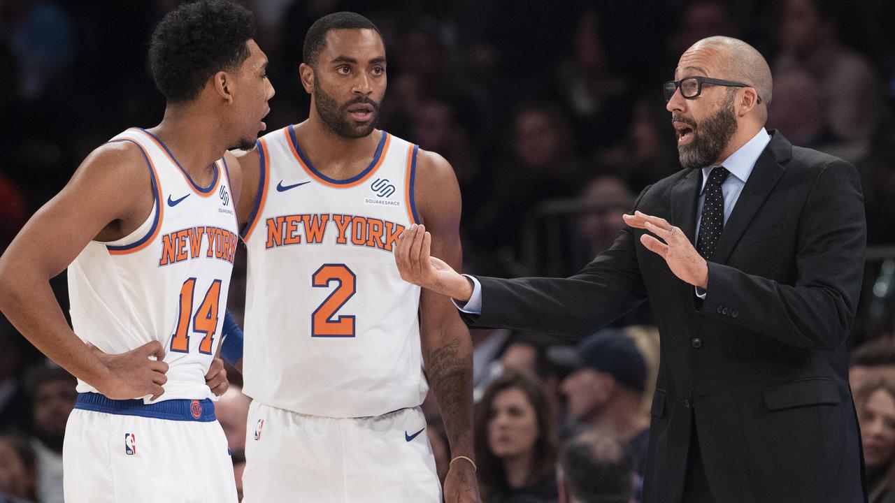 New York Knicks coach David Fizdale, right, talks to guard Allonzo Trier (14) and guard Wayne Ellington.