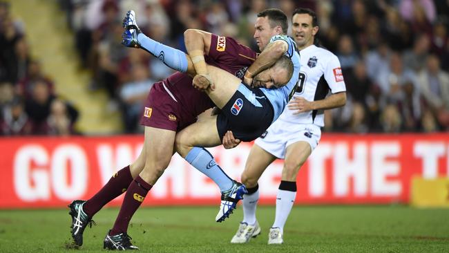 Nate Myles tackles James Maloney during a State of Origin game. Picture: Grant Trouville/NRL