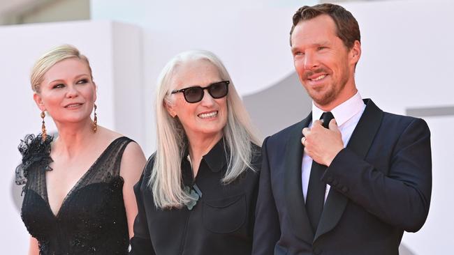 Jane Campion, centre, with Power of The Dog stars Kirsten Dunst and Benedict Cumberbatch. Picture: AFP