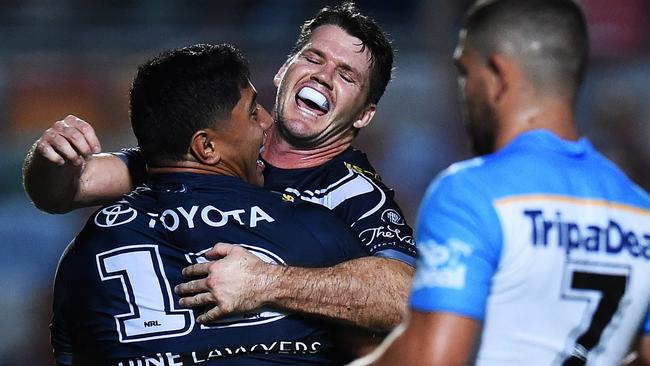 Lachlan Coote and Jason Taumalolo celebrate the Cowboys lock forward’s try in their 26-14 win over the Titans. Photo: Zak Simmonds