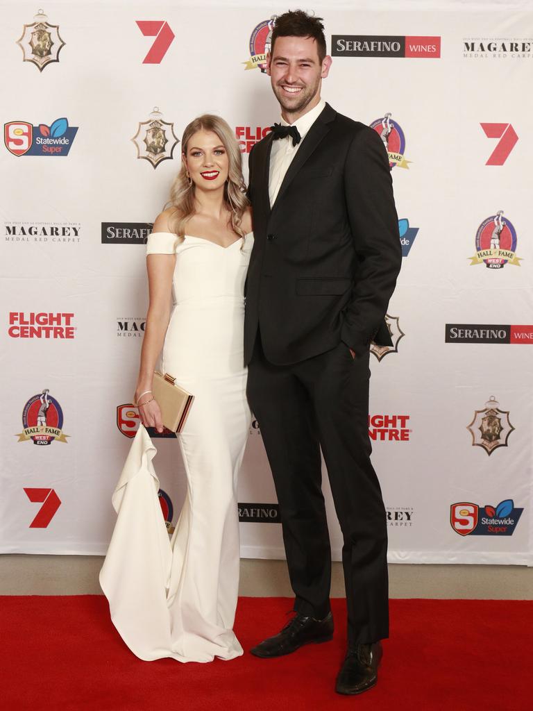 Shari Hinch wearing ONS boutique, and Tanner Smith pose for a picture on the red carpet at Adelaide Oval in North Adelaide, for the Magarey Medal, Monday, September 9, 2019. Picture: Matt Loxton