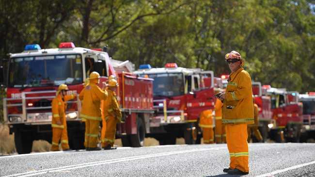 Volunteer fire crews plan containment lines on the Mid North Coast. Picture: DAN HIMBRECHTS