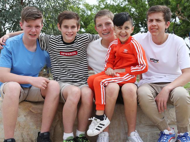 Four kids who performed CPR on a young boy who drowned in a pool last year have been reunited with him today. Pictuerd (left) is Jaime Privett, 14, Patrick Whitehouse, 12, Adam Al Kayal, 5, Zac Brown and Ben Whitehouse. Picture: David Swift.