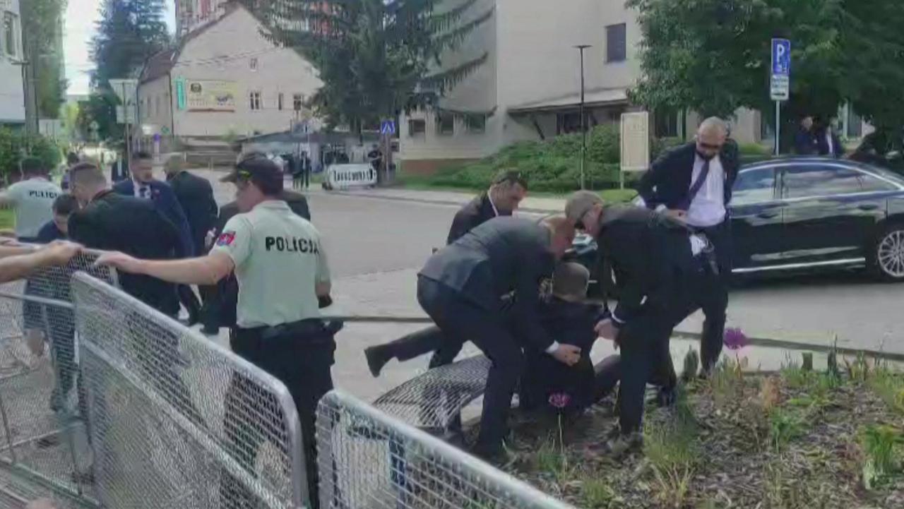 Security personnel carrying Slovakia's Prime Minister Robert Fico (C) towards a vehicle after he was shot in Handlova on May 15, 2024. (Photo by RTVS / AFP)