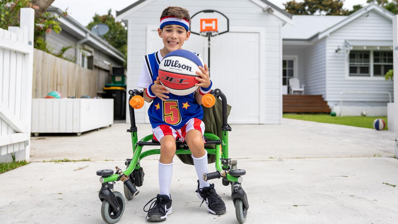 Hudson Nicholas, nine, lives with cerebral palsy and is climbing at Mount Kosciuszko as part of the Krazy Kosci Klimb for charity, along with 15 other young people with the condition. Picture: Thomas Lisson