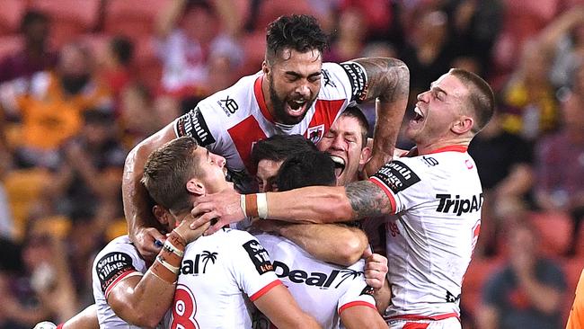 Dragons players celebrate after a field goal, winning the Round 3 NRL match between the Brisbane Broncos and St George Illawarra Dragons at Suncorp Stadium in Brisbane, Thursday, March 28, 2019. (AAP Image/Dave Hunt) NO ARCHIVING, EDITORIAL USE ONLY