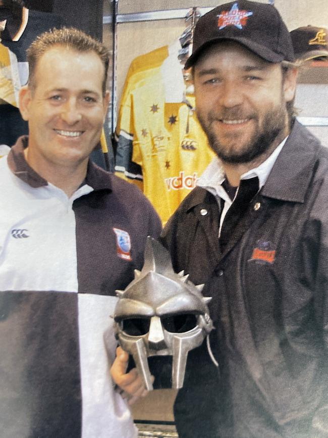 David Campese and Russell Crowe with<br eom-tag-name="br"/>one of the masks the superstar gave him.