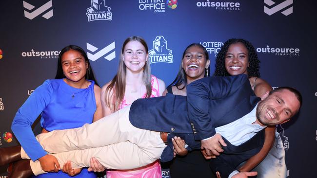 Eta Sikahele, Takoda Thompson, Savannah Roberts-Hickling, Phoenix-Raine Hippi with Aaron Booth at the Gold Coast Titans NRLW 2025 Season Launch at Isoletto The Star Gold Coast. Picture, Portia Large.