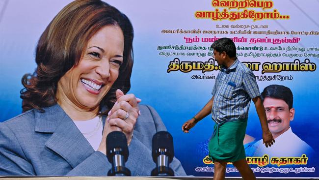 A man walks past a poster of US Vice President Kamala Harris in her ancestral village of Thulasendrapuram in the south Indian state of Tamil Nadu on July 23, 2024. Picture: AFP.