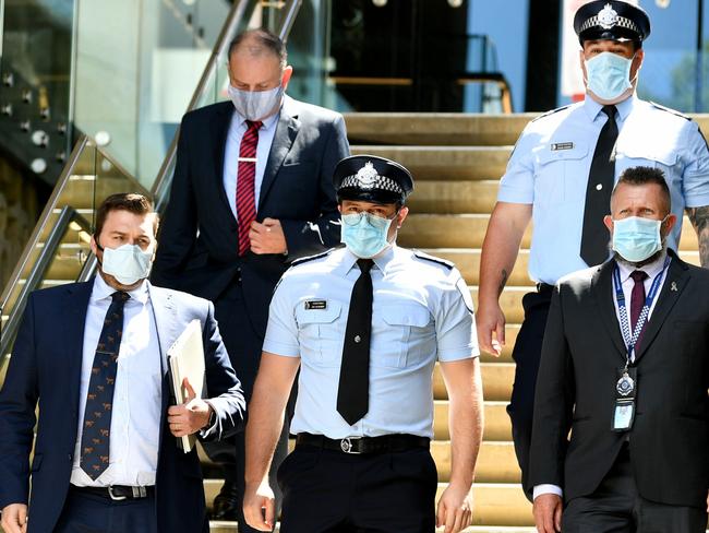 Constable Zachary Schembri (front) & Constable Shane Warren leave the Townsville Courthouse after giving evidence at an inquest. Pictured with Gilshenan & Luton Legal Practice lawyers and Queensland Police Union representative.  Picture: Alix Sweeney