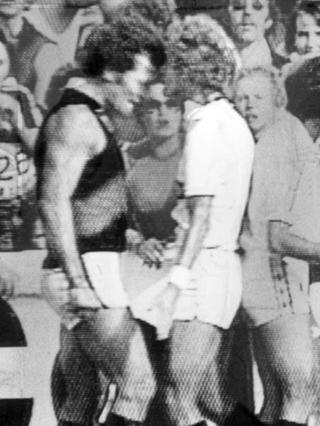 Essendon firebrand Phil Carman, left, eyeballs boundary umpire Graham Carberry and was later suspended for headbutting the umpire on April 19, 1990.