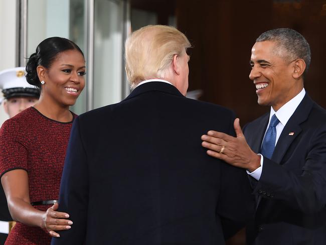 President-elect Donald Trump is greeted by US President Barack Obama and First Lady Michelle Obama as he arrives at the White House in Washington, DC January 20, 2017. Picture: AFP