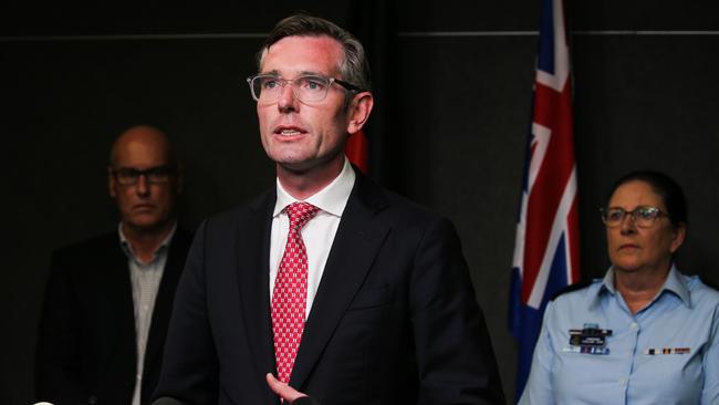 NSW Premier Dominic Perrottet (centre) Meterologist Graheme Reader and NSW SES Commissioner Carlene York provide an update on the flood crisis. Picture: NCA Newswire/ Gaye Gerard