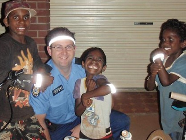 Constable Ryan Marron with some kids at Halls Creek before he contracted Murray Valley Encephalitis : Picture: Facebook