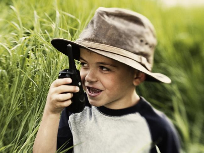 Young boy with walkie-talkie. iStock.