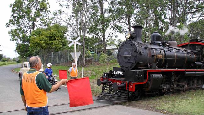 BLAST FROM THE PAST: Geoff Harvey (front) and Reg Lawler (rear) flagging the Rattler at Dagun railway station in previous years.