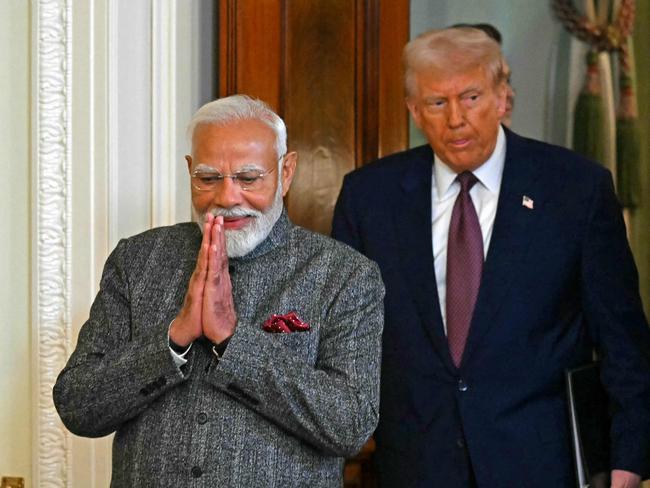 TOPSHOT - US President Donald Trump and Indian Prime Minister Narendra Modi arrive to hold a joint press conference in the East Room of the White House in Washington, DC, on February 13, 2025. (Photo by ANDREW CABALLERO-REYNOLDS / AFP)