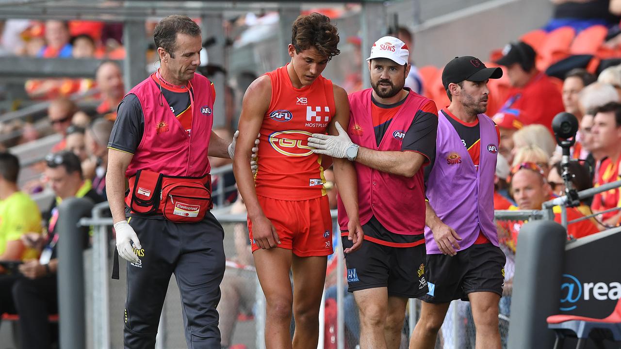 Will Powell of the Suns is taken from the field with concussion during the Round 4 AFL match between the Gold Coast Suns and the Carlton Blues at Metricon Stadium on the Gold Coast, Sunday, April 14, 2019. (AAP Image/Dave Hunt) NO ARCHIVING, EDITORIAL USE ONLY