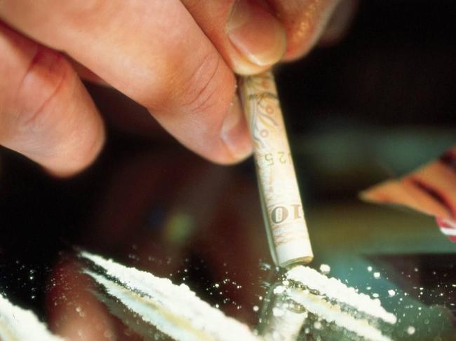 Cocaine being snorted off a mirror on a dinner plate with rolled $50 note. NSW / Drug Use Generic