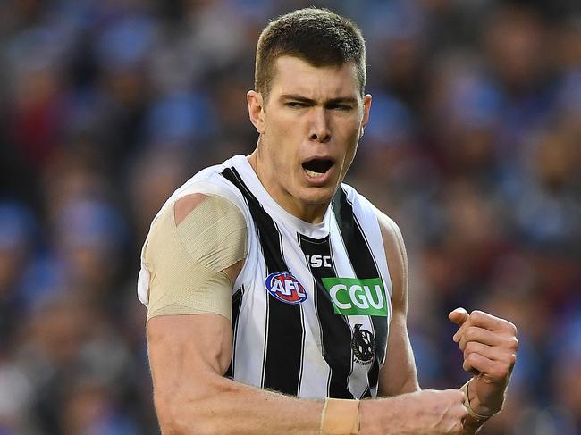 Mason Cox of the Magpies reacts after kicking a goal during the Round 12 AFL match between the Melbourne Demons and the Collingwood Magpies at the MCG in Melbourne, Monday, June 11, 2018. (AAP Image/Julian Smith) NO ARCHIVING, EDITORIAL USE ONLY