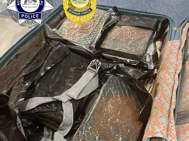 They allegedly found 22 vacuum sealed packages of a white substance hidden in the man’s suitcase. Picture: AFP