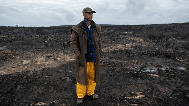 Vivonne Bay resident Rick Slager inspects the area after fighting fires all week. Picture: Brad Fleet