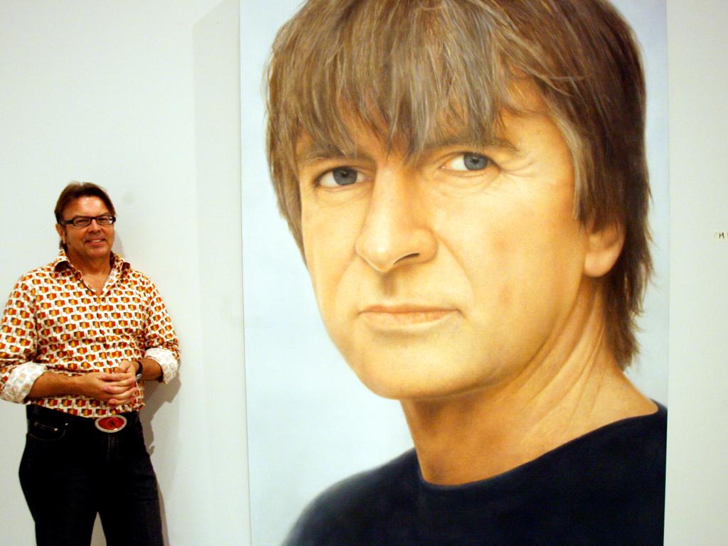 Artist Martin Ball with his winning portrait of Neil Finn.