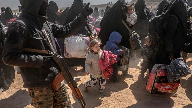 Women and children evacuated from an Islamic State group's embattled holdout arrive at a screening area held by US-backed Kurdish-led Syrian Democratic Forces in Syria on March 6. Picture: Bulent Kilic/AFP