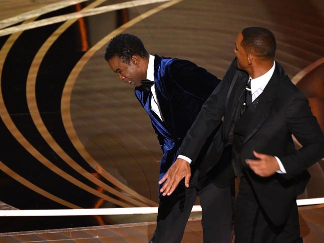 -- AFP PICTURES OF THE YEAR 2022 --  US actor Will Smith (R) slaps US actor Chris Rock onstage during the 94th Oscars at the Dolby Theatre in Hollywood, California on March 27, 2022. (Photo by Robyn Beck / AFP) / AFP PICTURES OF THE YEAR 2022