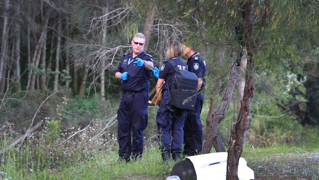 Police investigate the crash site. Picture Glenn Hampson