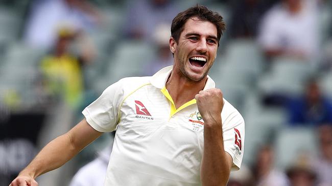 Australian fast bowler Pat Cummins celebrates taking the wicket of England’s Dawid Malan on Monday.