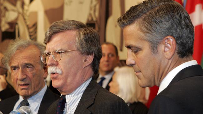John Bolton, pictured with Nobel Peace Prize winner Elie Wiesel and actor George Clooney, is being considered as Secretary of State.