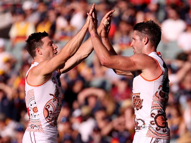 Giants forwards Toby Greene and Jesse Hogan celebrate a goal against Adelaide in Round 7. Picture: AFL Photos/Getty Images