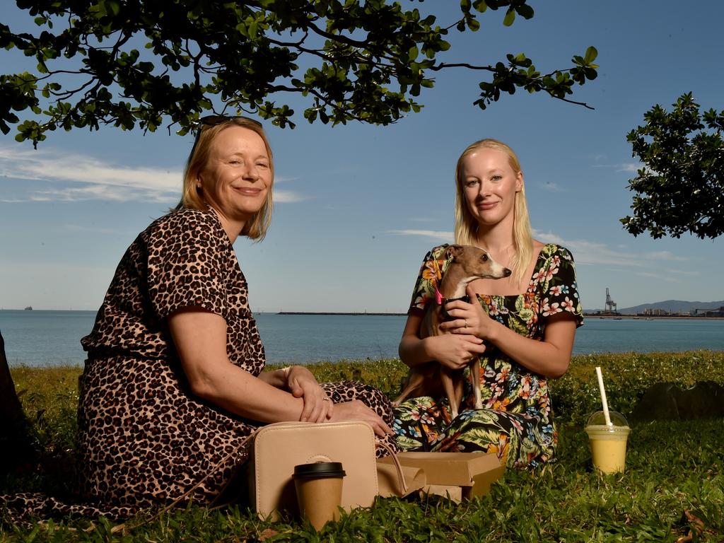 Townsville residents relaxing on the Strand after the relaxation of COVID-19 restrictions. Emma Anderson with daughter Katy Tucker with Lola from Idalia. Picture: Evan Morgan