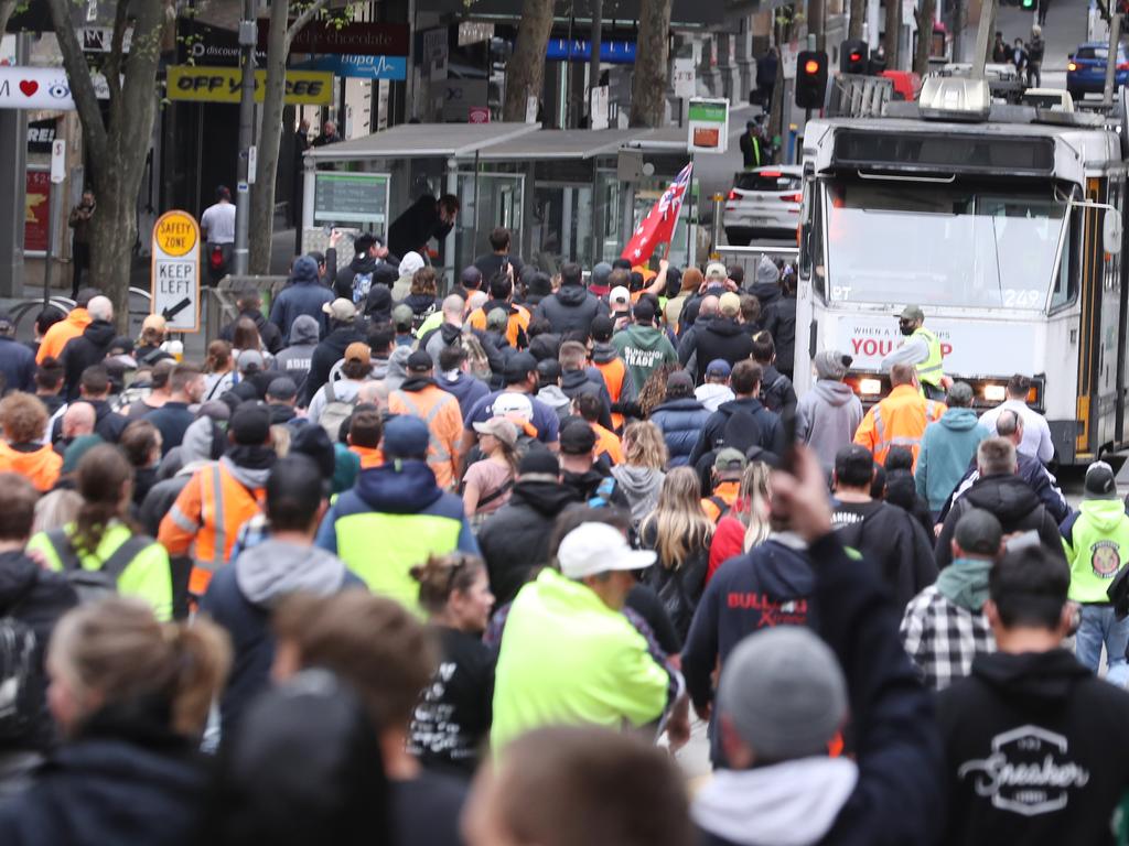 Hundreds of people marched through Melbourne as part of the protest. Picture: David Crosling