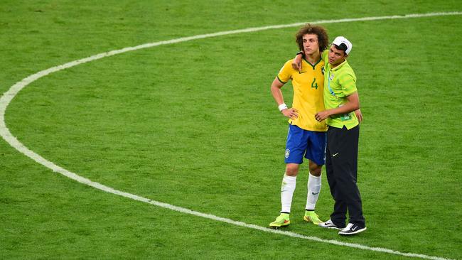 Thiago Silva of Brazil consoles David Luiz after Germany's 7-1 victory.