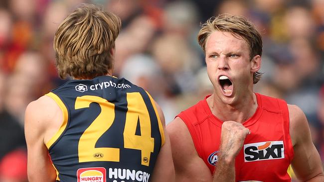 Adelaide, AUSTRALIA - AUGUST 5: Jack Lukosius of the Suns celebrates a goal as he comes towards Josh Worrell of the Crows during the 2023 AFL Round 21 match between the Adelaide Crows and the Gold Coast SUNS at Adelaide Oval on August 5, 2023 in Adelaide, Australia. (Photo by Sarah Reed/AFL Photos via Getty Images)