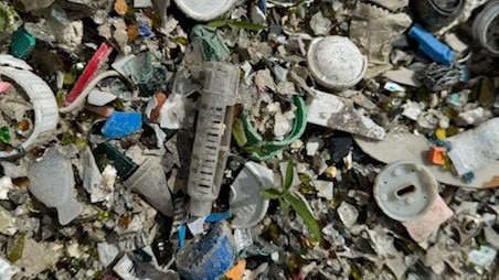 The pile of waste left by the roadside near the intersection of Old Bruce Highway and Kenilworth Skyring Creek Road appears to have been illegally dumped by a business or contractor.