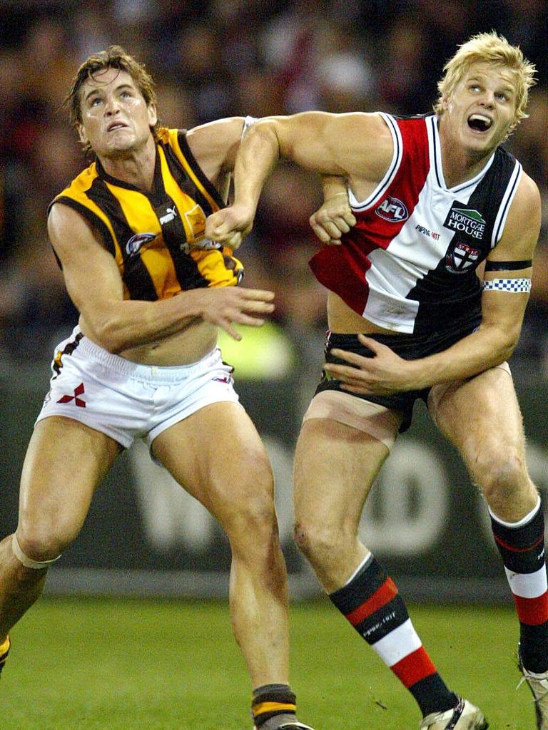 Trent Croad and Nick Riewoldt jostle for marking position.